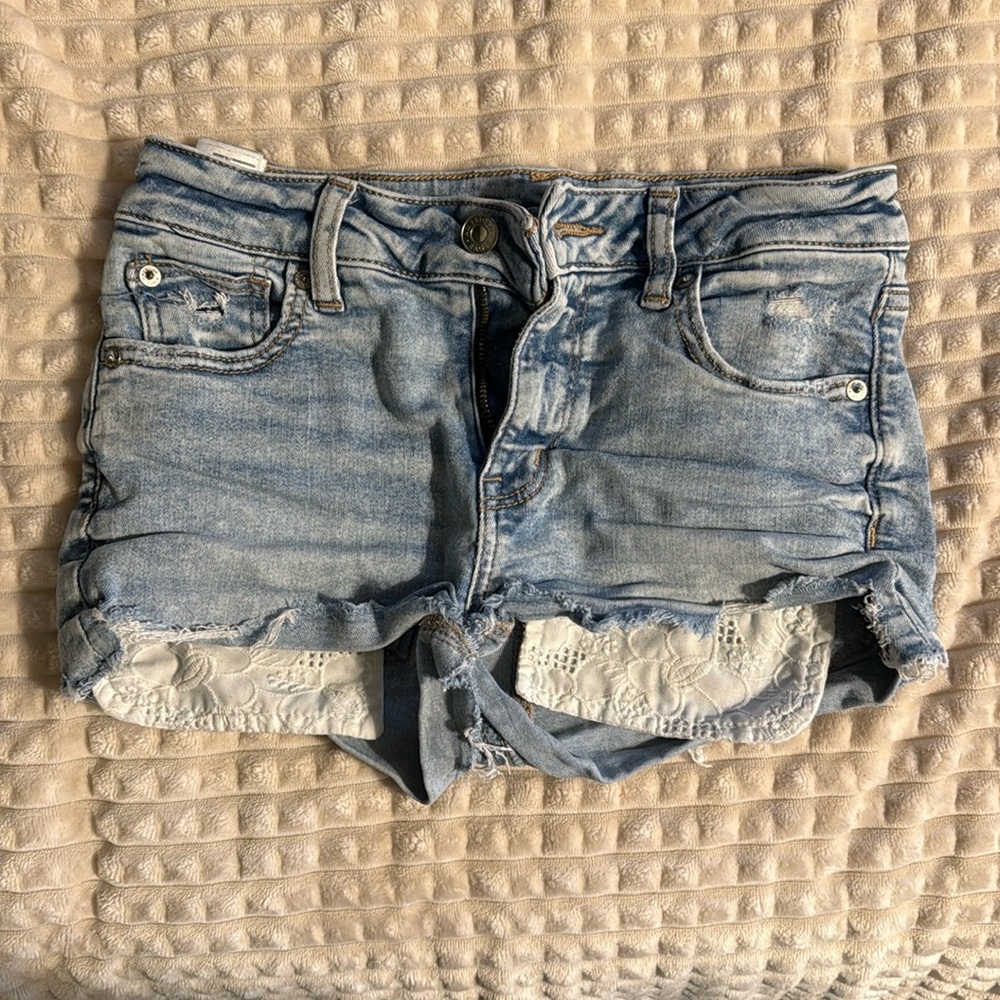 American eagle next level stretch jean short with white floral pockets size 0